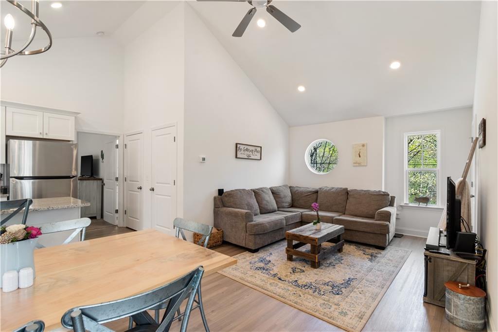 305 Ridgewood Drive Waleska, GA 30183 - Photo 12 of 56 a living room with furniture a flat screen tv and a table