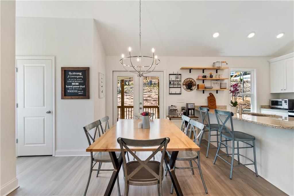 305 Ridgewood Drive Waleska, GA 30183 - Photo 18 of 56 a view of a dining room with furniture and wooden floor