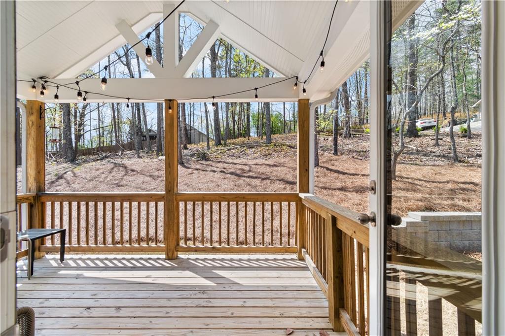 305 Ridgewood Drive Waleska, GA 30183 - Photo 19 of 56 a view of a balcony with a floor to ceiling window wooden floor