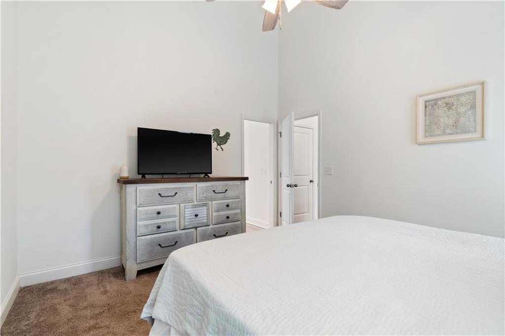 305 Ridgewood Drive Waleska, GA 30183 - Photo 28 of 56 a bedroom with a bed and a flat screen tv