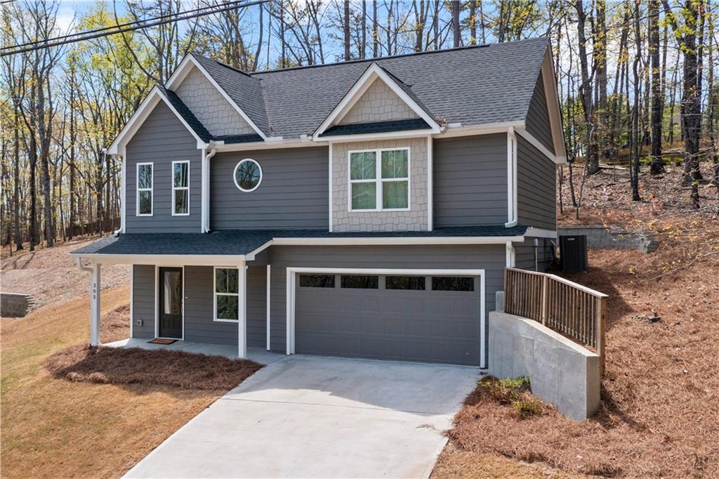 305 Ridgewood Drive Waleska, GA 30183 - Photo 33 of 56 a front view of a house with a garage