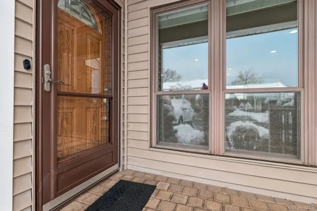 a view of a bathroom that has a glass door