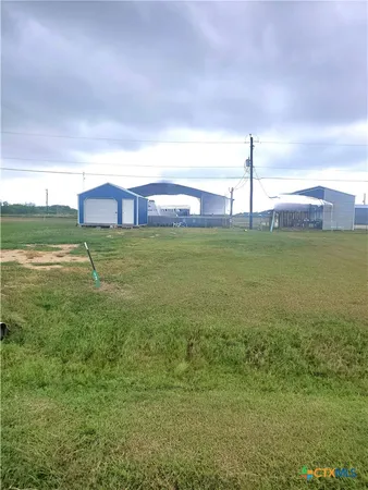 a view of a golf course with a big yard