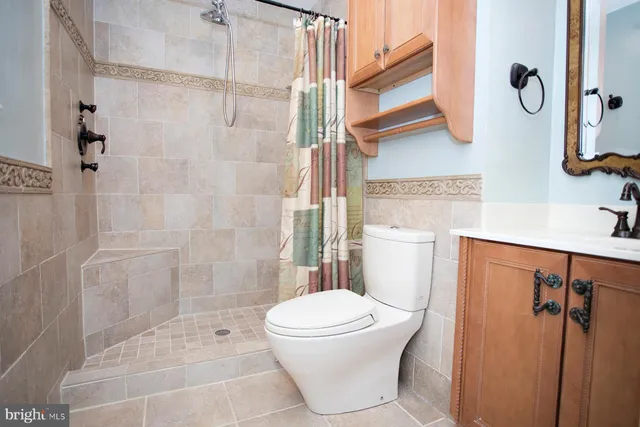 a bathroom with a toilet and shower