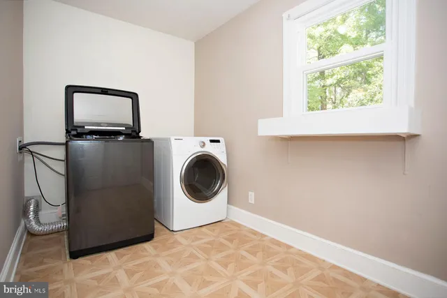 a view of a storage & utility room with a window