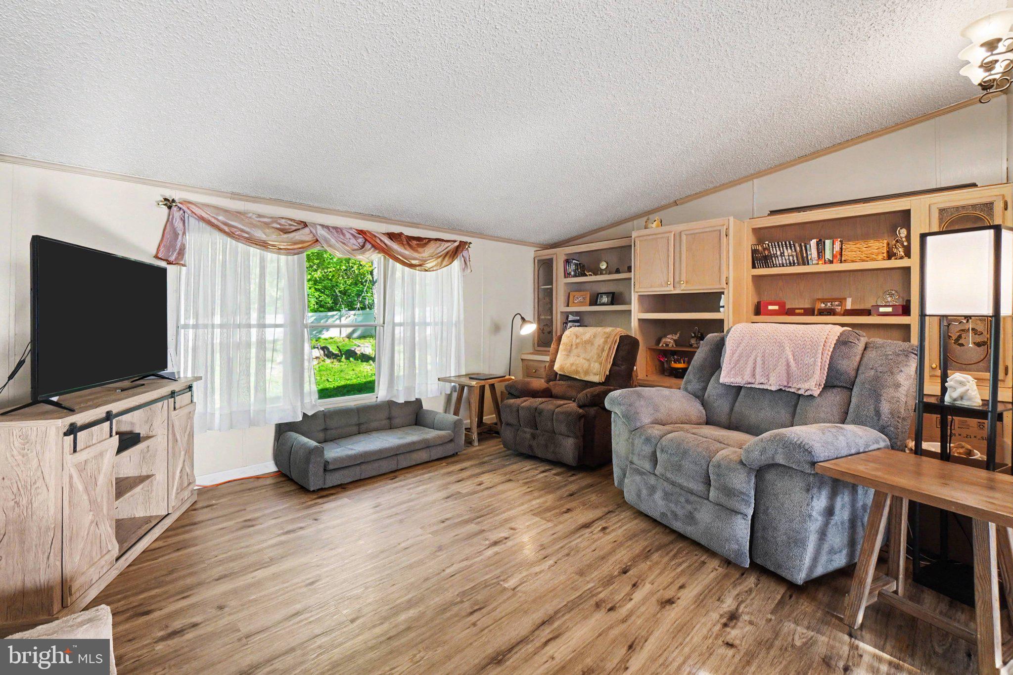 46 Pisgah Rest Shermans Dale, PA 17090 - Photo 11 of 36 a living room with furniture and a flat screen tv