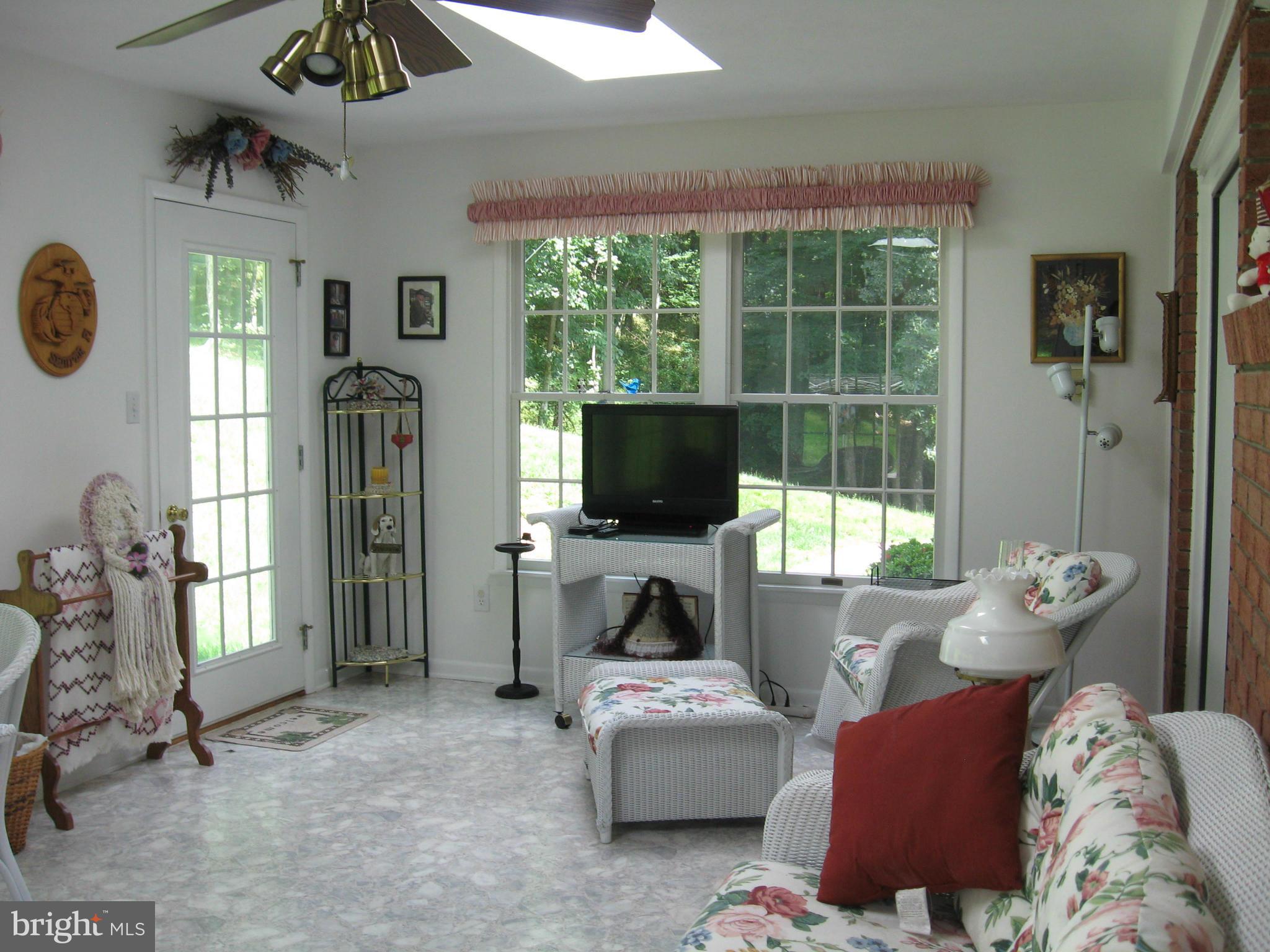 1042 Winchester Grade Road Berkeley Springs, WV 25411 - Photo 10 of 29 Sun Room