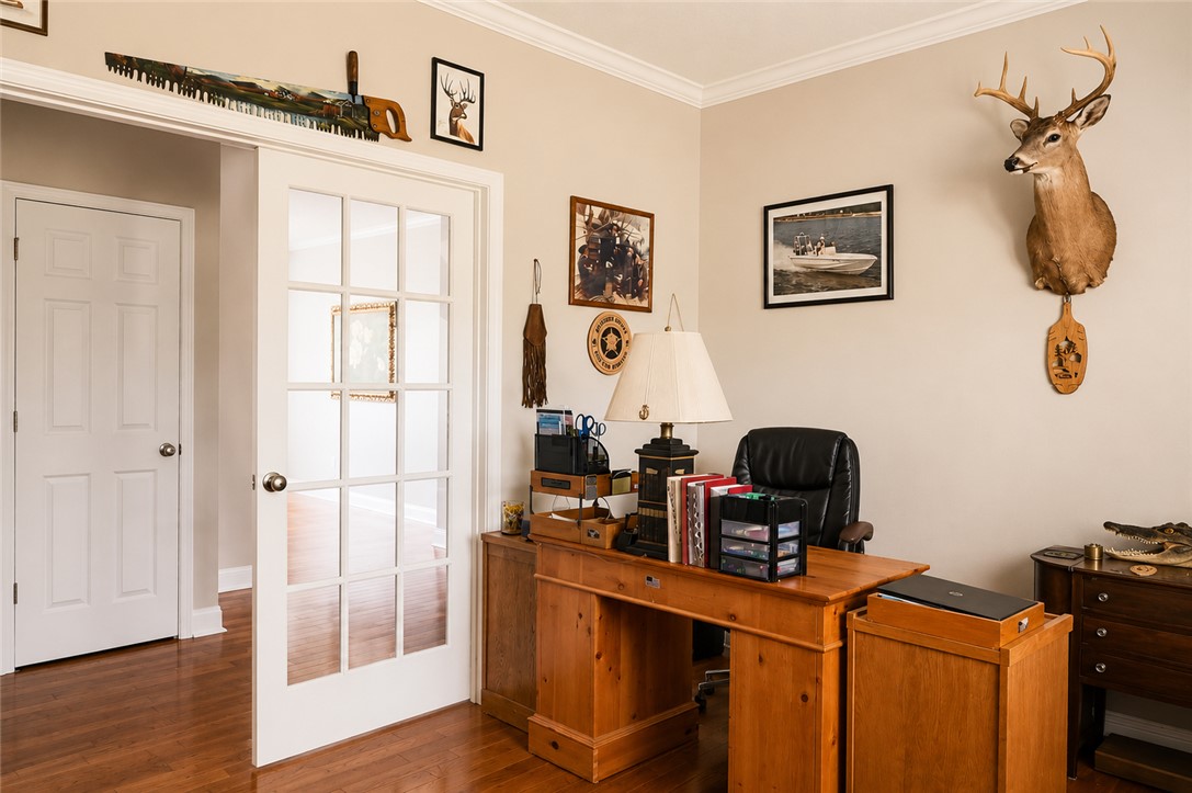 190 Fred Bradford Road Iva, SC 29655 - Photo 24 of 32 This office space features elegant hardwood flooring and classic crown molding, perfect for focused productivity.