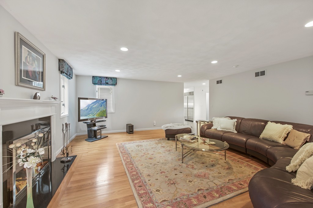 4 Yolande Road Marblehead, MA 01945 - Photo 13 of 30 a living room with furniture a fireplace and a flat screen tv