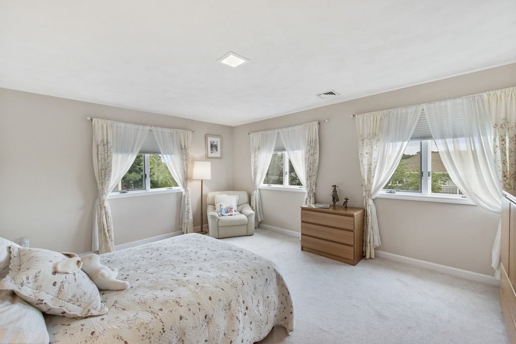 4 Yolande Road Marblehead, MA 01945 - Photo 19 of 30 a bedroom with a bed and a window