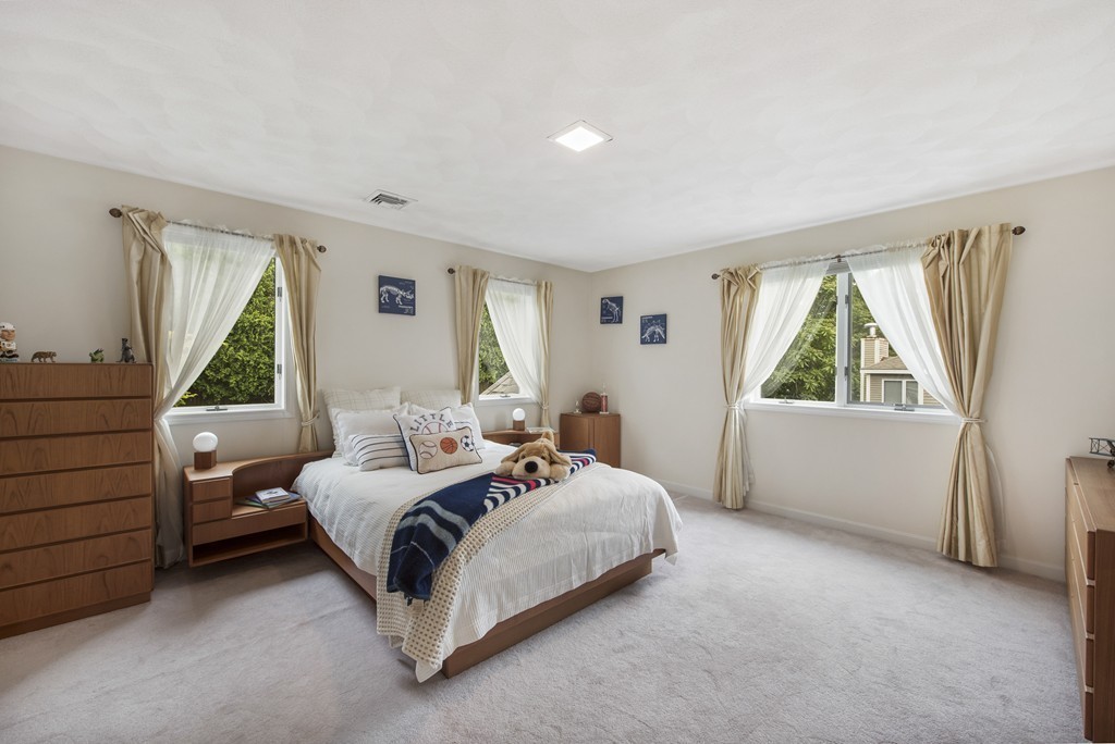 4 Yolande Road Marblehead, MA 01945 - Photo 20 of 30 a bedroom with a bed and a large window
