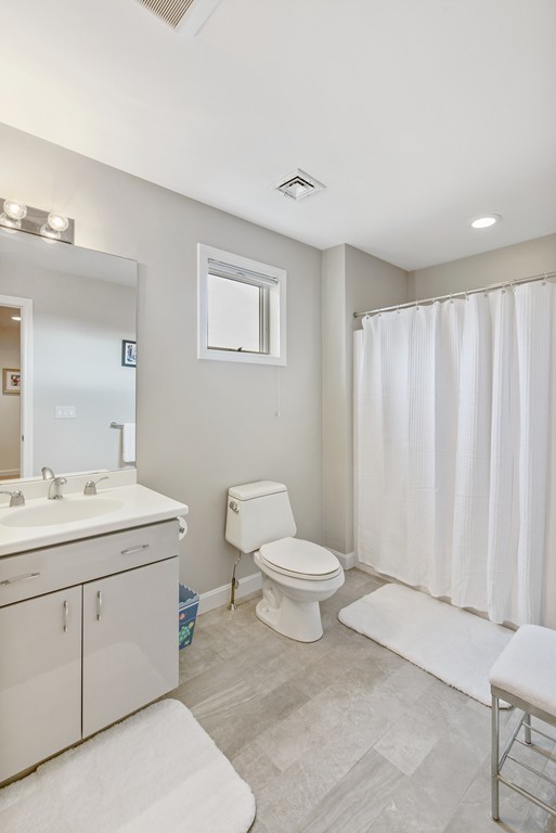 4 Yolande Road Marblehead, MA 01945 - Photo 21 of 30 a bathroom with a toilet sink and mirror