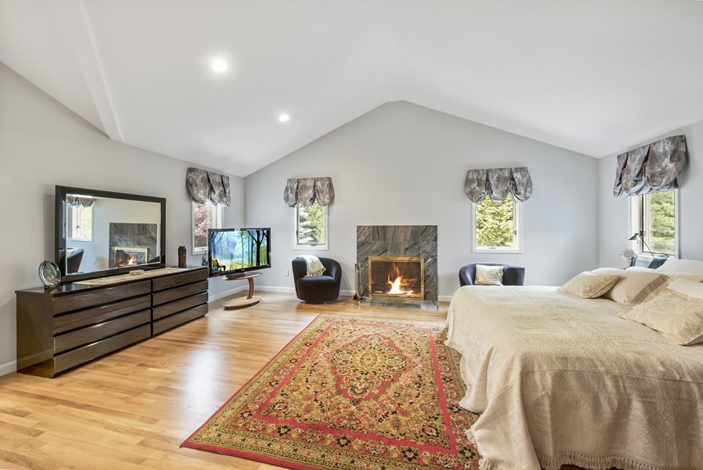 4 Yolande Road Marblehead, MA 01945 - Photo 24 of 30 a bed room with furniture and a fireplace