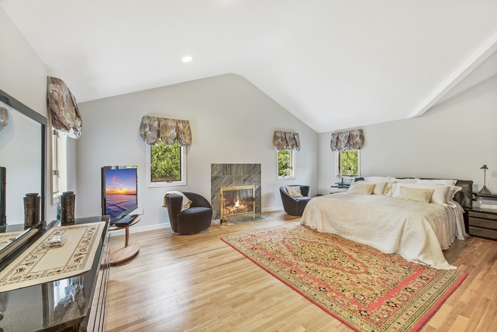 4 Yolande Road Marblehead, MA 01945 - Photo 25 of 30 a bedroom with a bed wooden floor and window