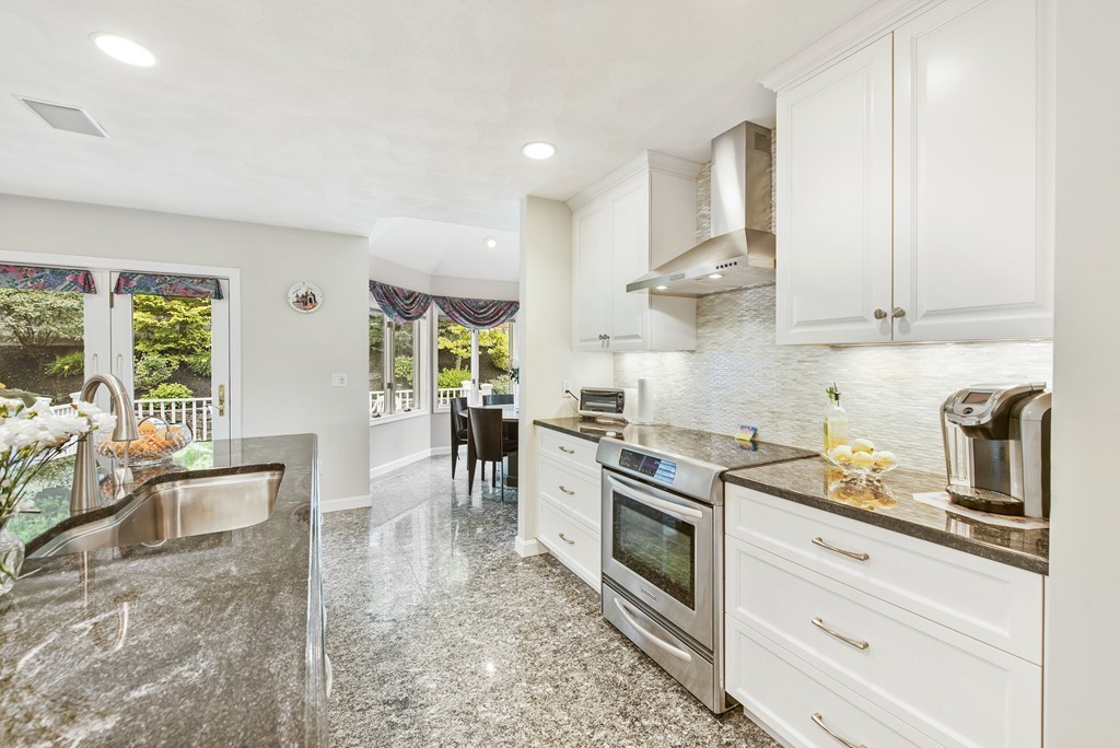 4 Yolande Road Marblehead, MA 01945 - Photo 7 of 30 a kitchen with stainless steel appliances granite countertop a stove a sink and a refrigerator