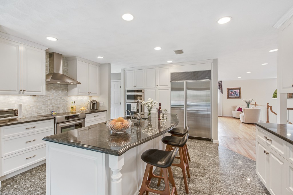 4 Yolande Road Marblehead, MA 01945 - Photo 8 of 30 a kitchen with stainless steel appliances granite countertop sink stove refrigerator and cabinets