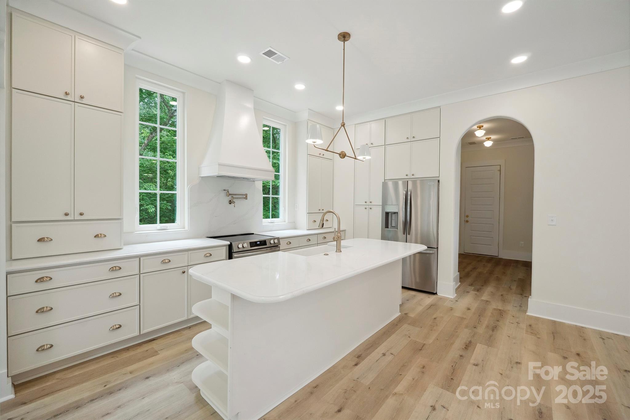 3622 East Brief Road Monroe, NC 28110 - Photo 8 of 48 a large white kitchen with a large window