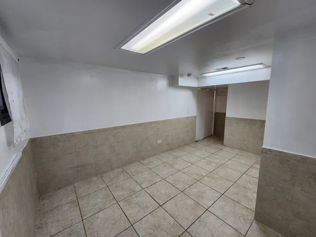 a view of a backyard with wooden fence