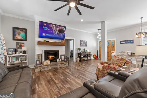 a kitchen with stainless steel appliances granite countertop a stove and white cabinets