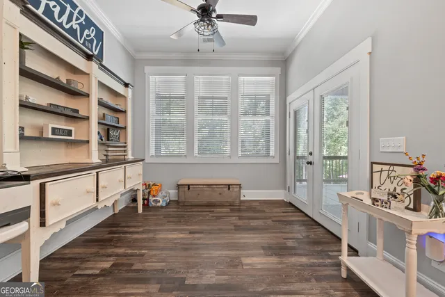 a open kitchen with stainless steel appliances granite countertop a stove and a wooden floors