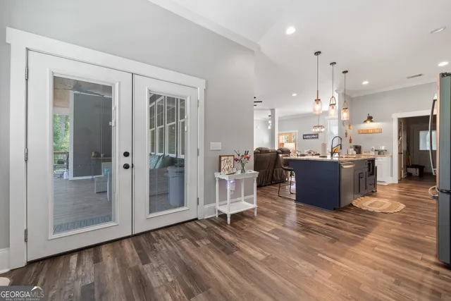 a kitchen with stainless steel appliances white cabinets and a sink
