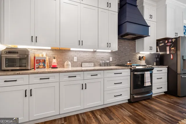 a view of a hallway with paintings on the wall