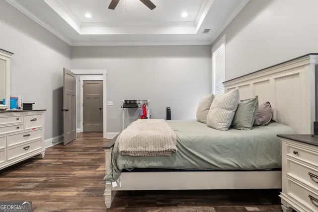 a living room with furniture a couch and a bookshelf