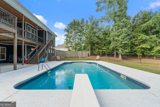 a view of a swimming pool with a patio
