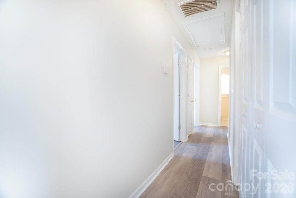 122 Addison Place Troutman, NC 28166 - Photo 14 of 40 a view of a room with wooden floor