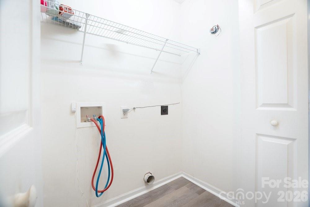 122 Addison Place Troutman, NC 28166 - Photo 15 of 40 a view of a room with racks on the wall