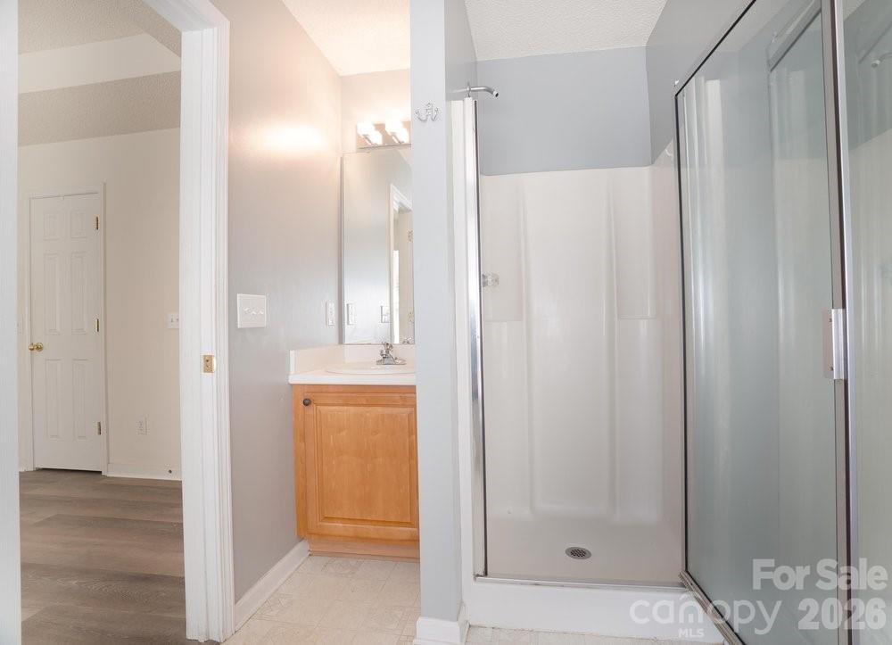 122 Addison Place Troutman, NC 28166 - Photo 19 of 40 a view of bathroom with a shower and a sink