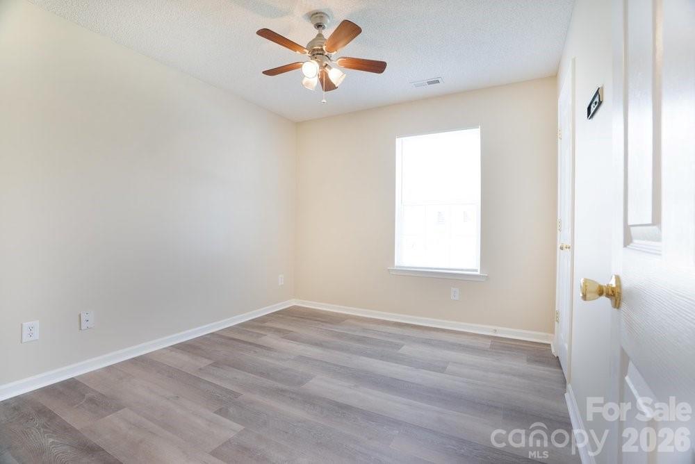 122 Addison Place Troutman, NC 28166 - Photo 24 of 40 a view of an empty room with a window