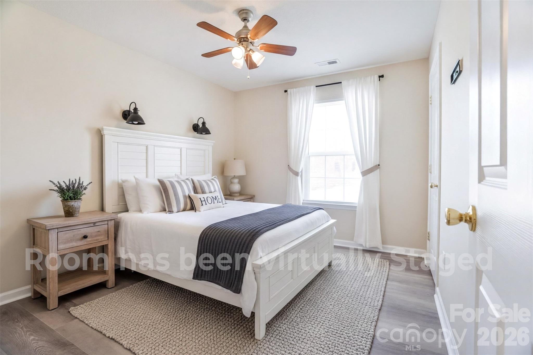 122 Addison Place Troutman, NC 28166 - Photo 25 of 40 a bed room with a bed and a chandelier