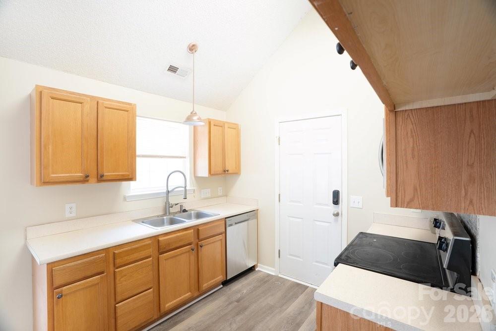 122 Addison Place Troutman, NC 28166 - Photo 10 of 40 a kitchen with a sink and a window