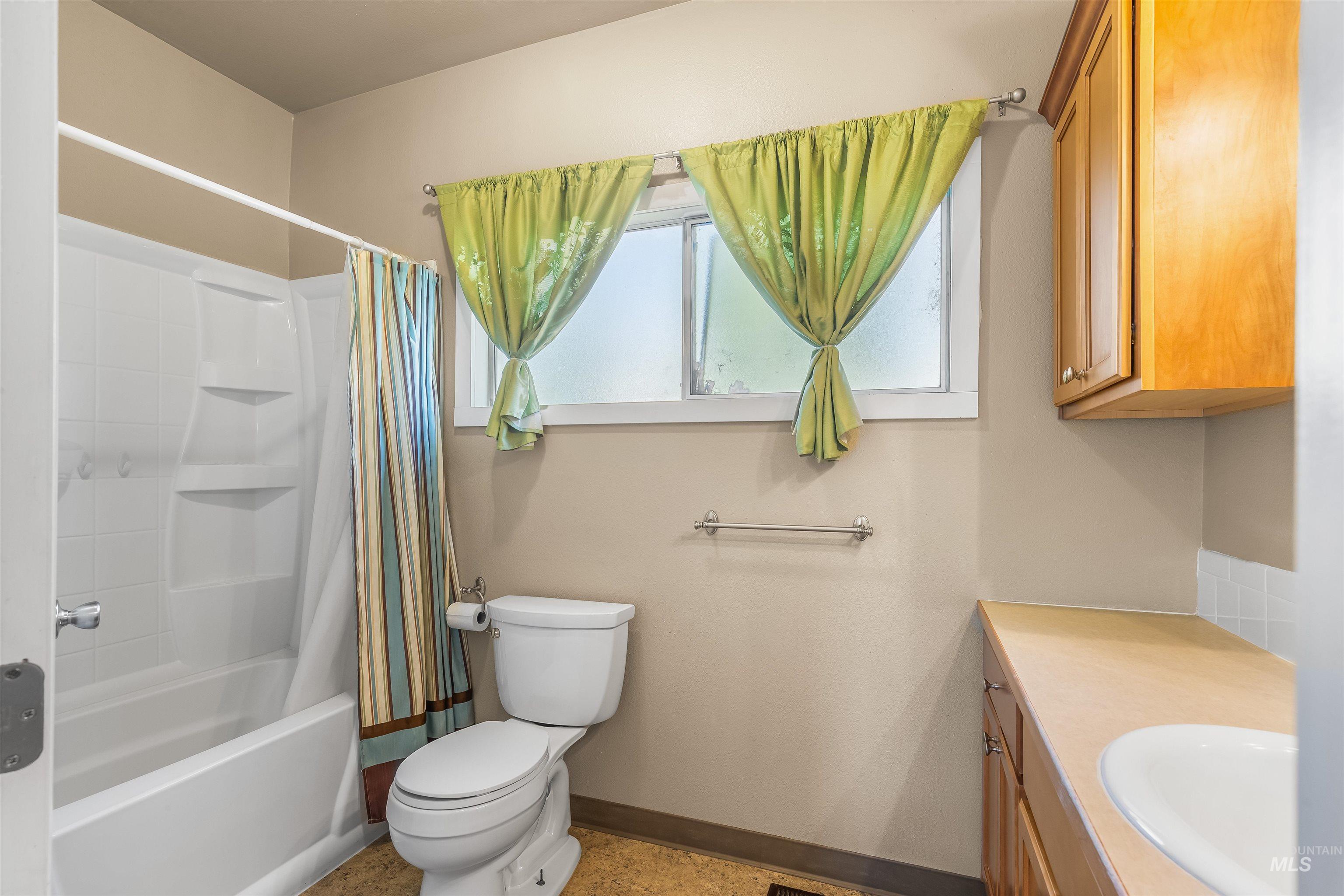 815 2nd Street Asotin, WA 99402 - Photo 17 of 50 Bathroom with vanity and shower / tub combo with curtain