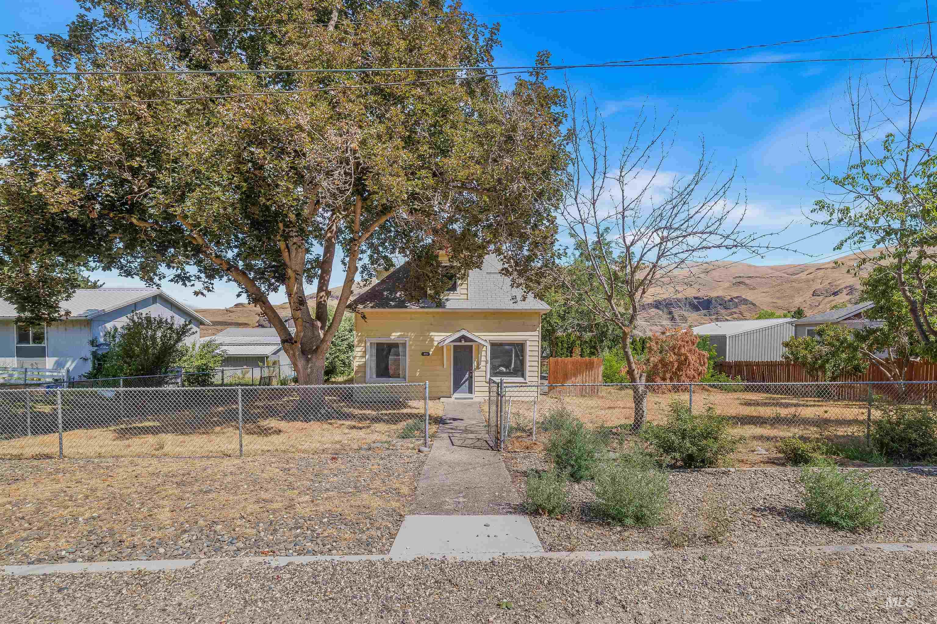 815 2nd Street Asotin, WA 99402 - Photo 2 of 50 View of front facade with a fenced front yard and a gate