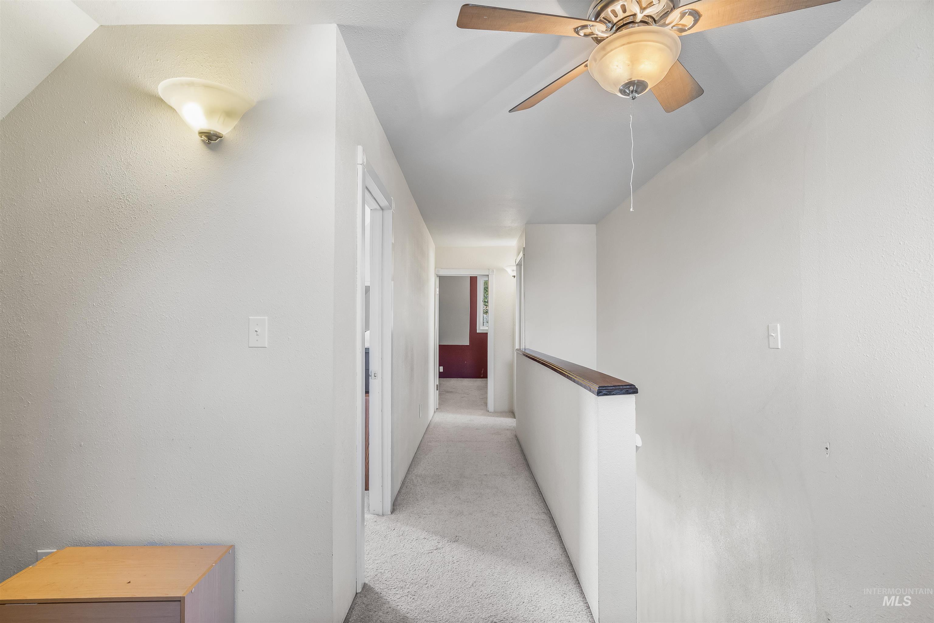 815 2nd Street Asotin, WA 99402 - Photo 24 of 50 Hall with light carpet and an upstairs landing
