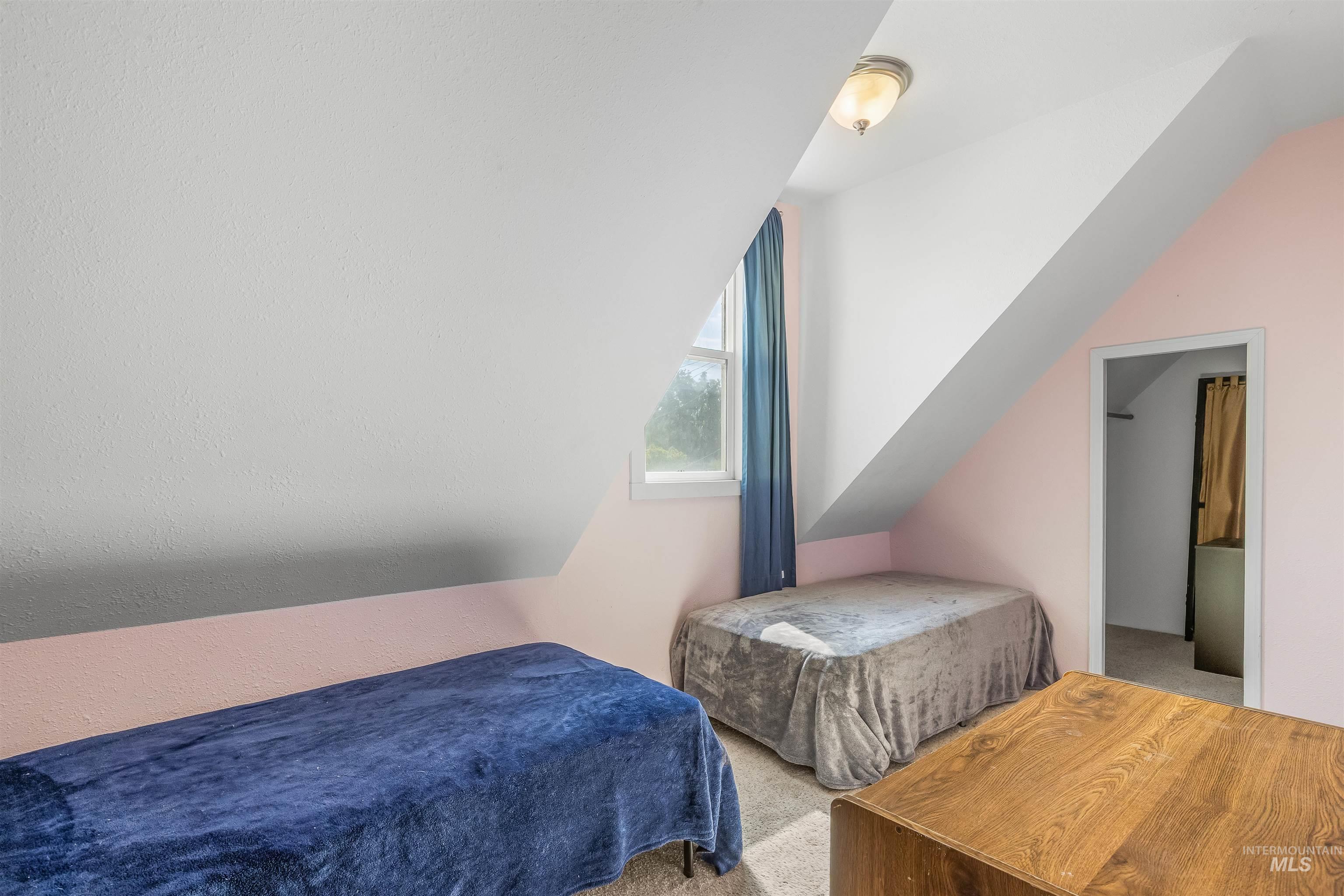 815 2nd Street Asotin, WA 99402 - Photo 27 of 50 Bedroom with carpet flooring and vaulted ceiling