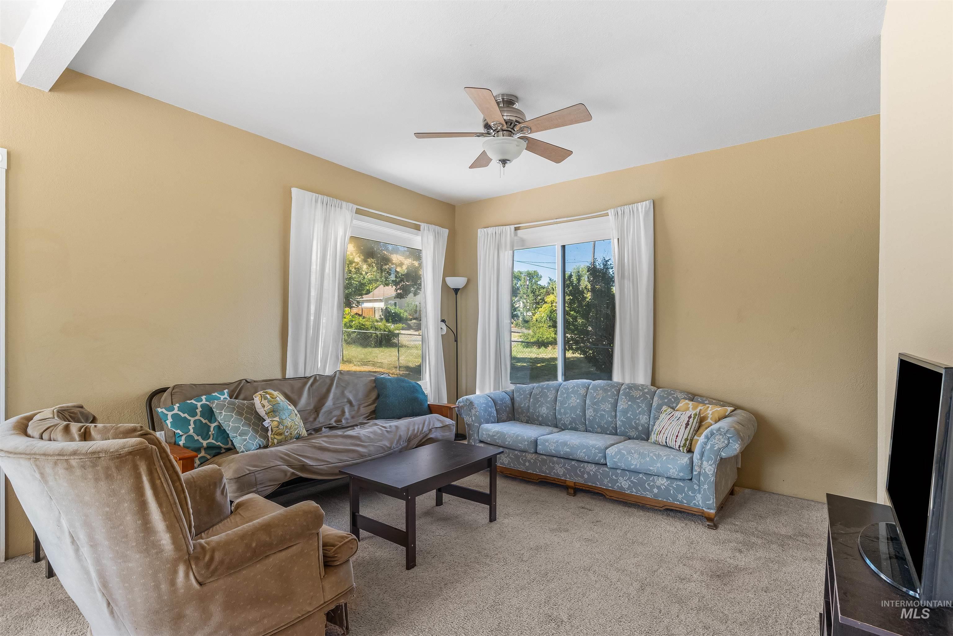 815 2nd Street Asotin, WA 99402 - Photo 3 of 50 Carpeted living area featuring a ceiling fan