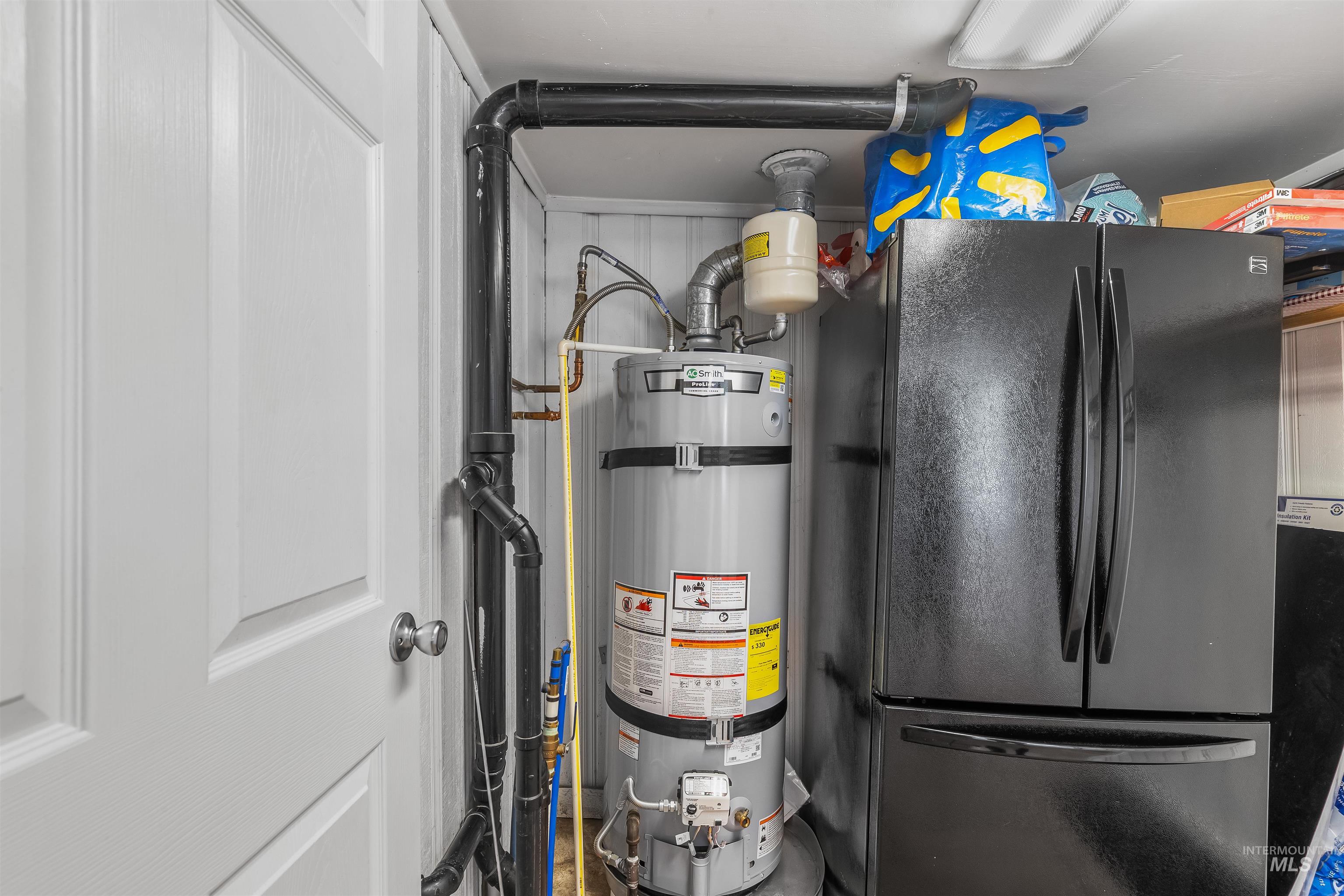 815 2nd Street Asotin, WA 99402 - Photo 35 of 50 Utility room featuring water heater