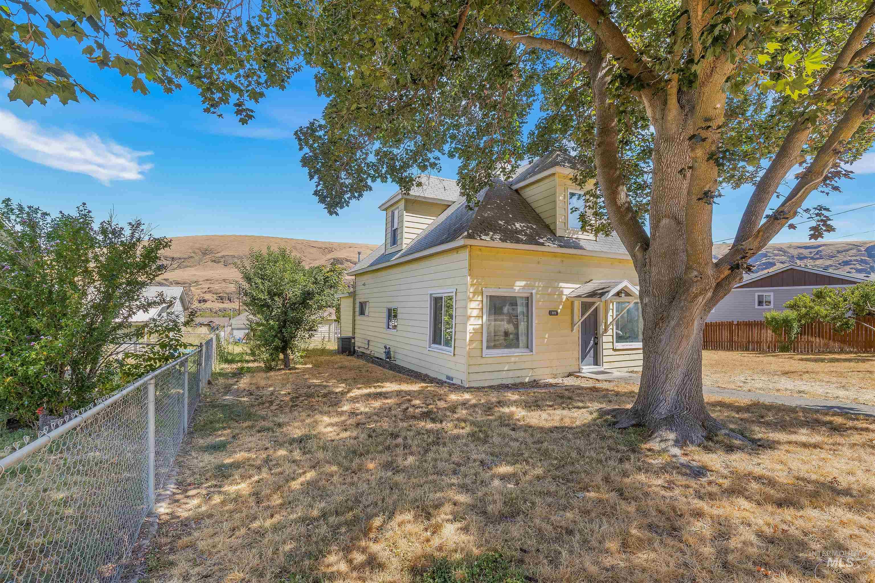 815 2nd Street Asotin, WA 99402 - Photo 38 of 50 View of property exterior featuring a fenced backyard and a mountain view