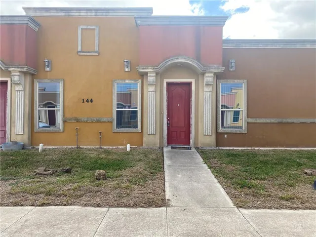 a front view of a house with yard