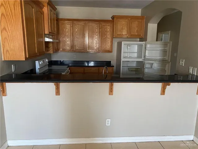 a view of a counter top space and cabinets