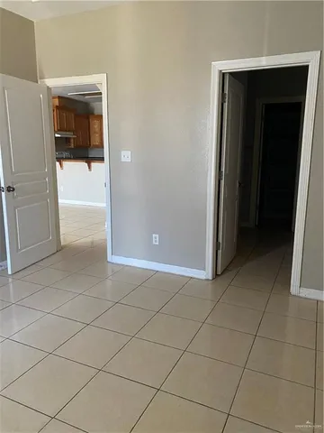 a bathroom with a granite countertop sink mirror and a bathtub