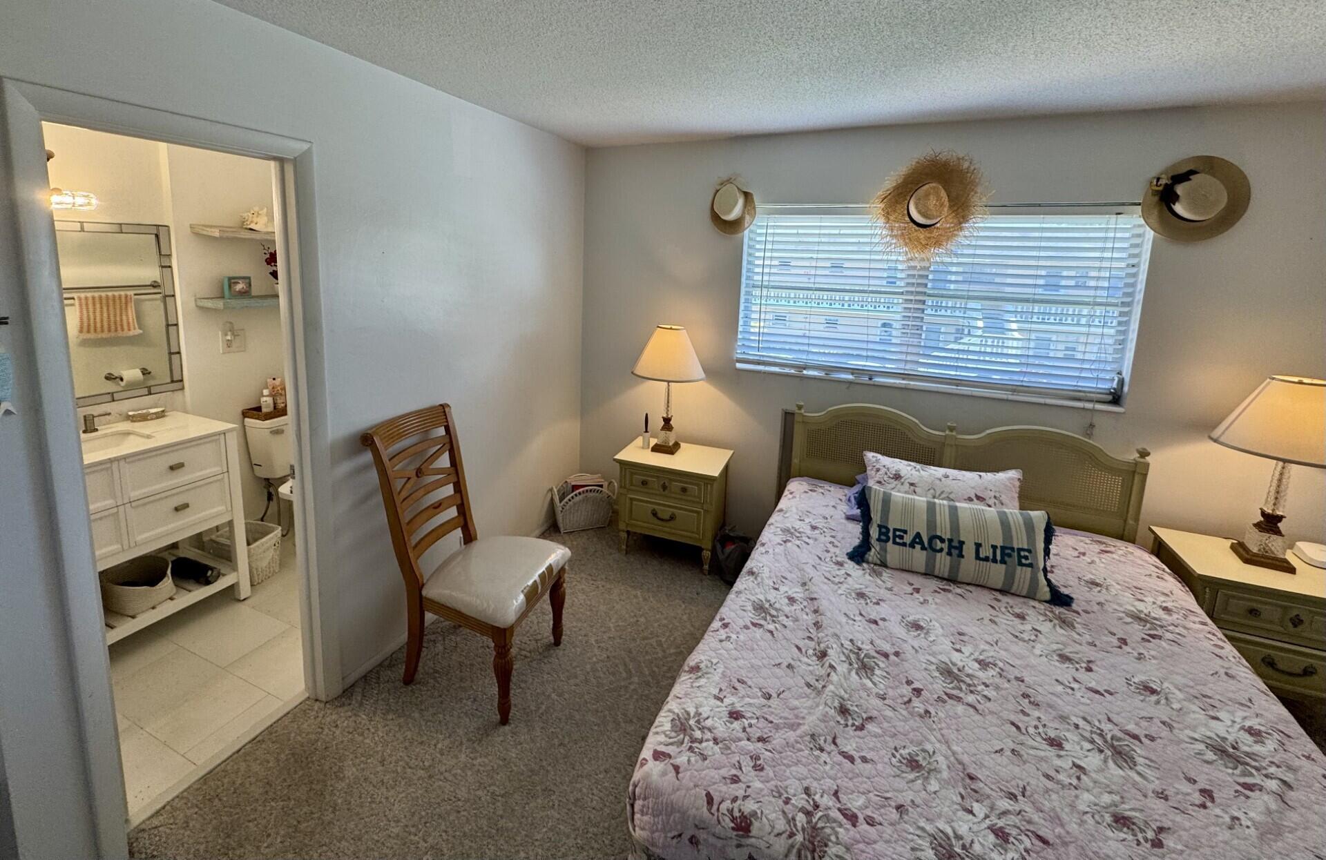 2222 Northeast 1st Way, Unit 204 Boynton Beach, FL 33435 - Photo 7 of 26 En-Suite Bedroom