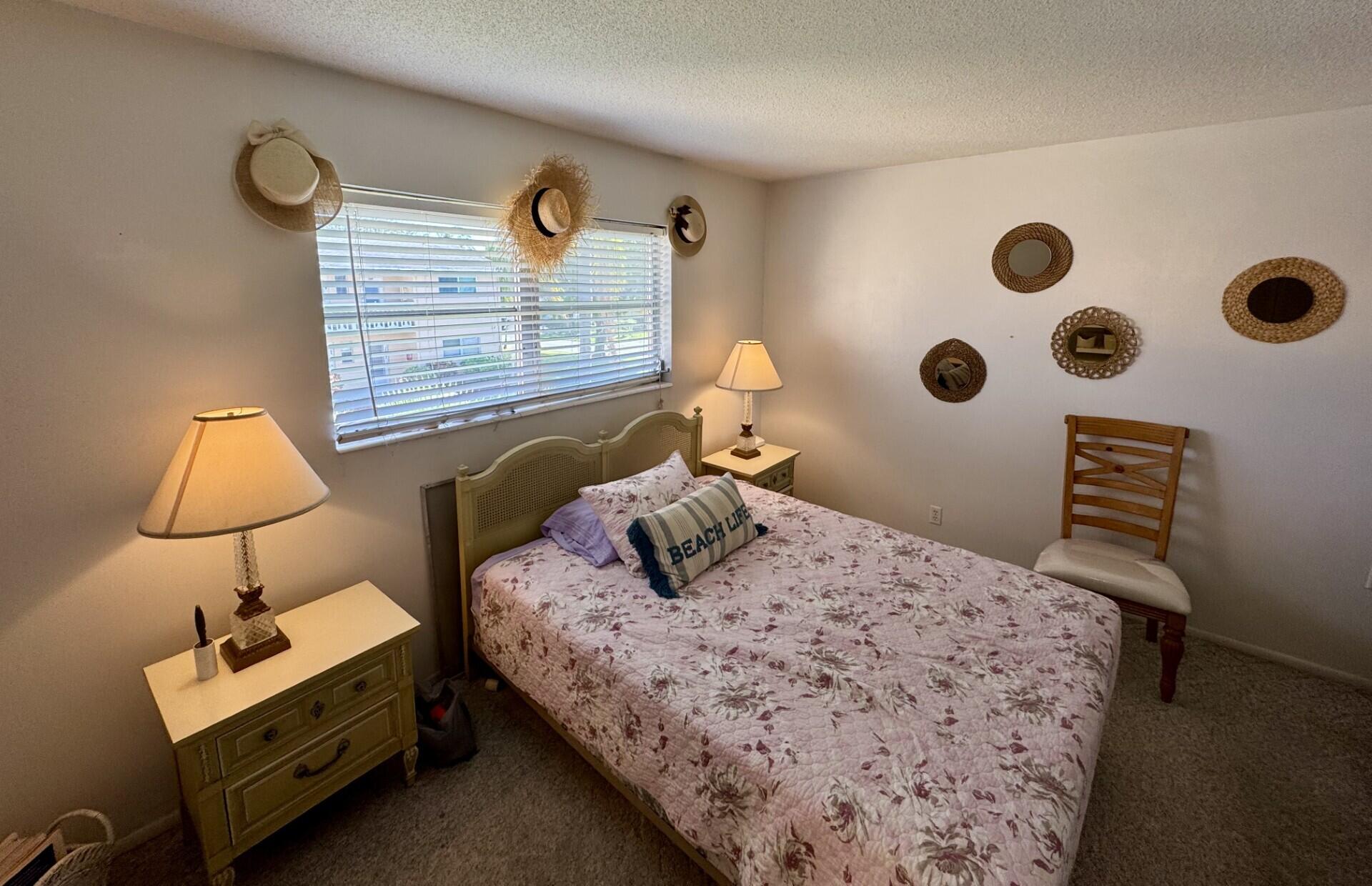 2222 Northeast 1st Way, Unit 204 Boynton Beach, FL 33435 - Photo 9 of 26 Primary En-Suite Bedroom