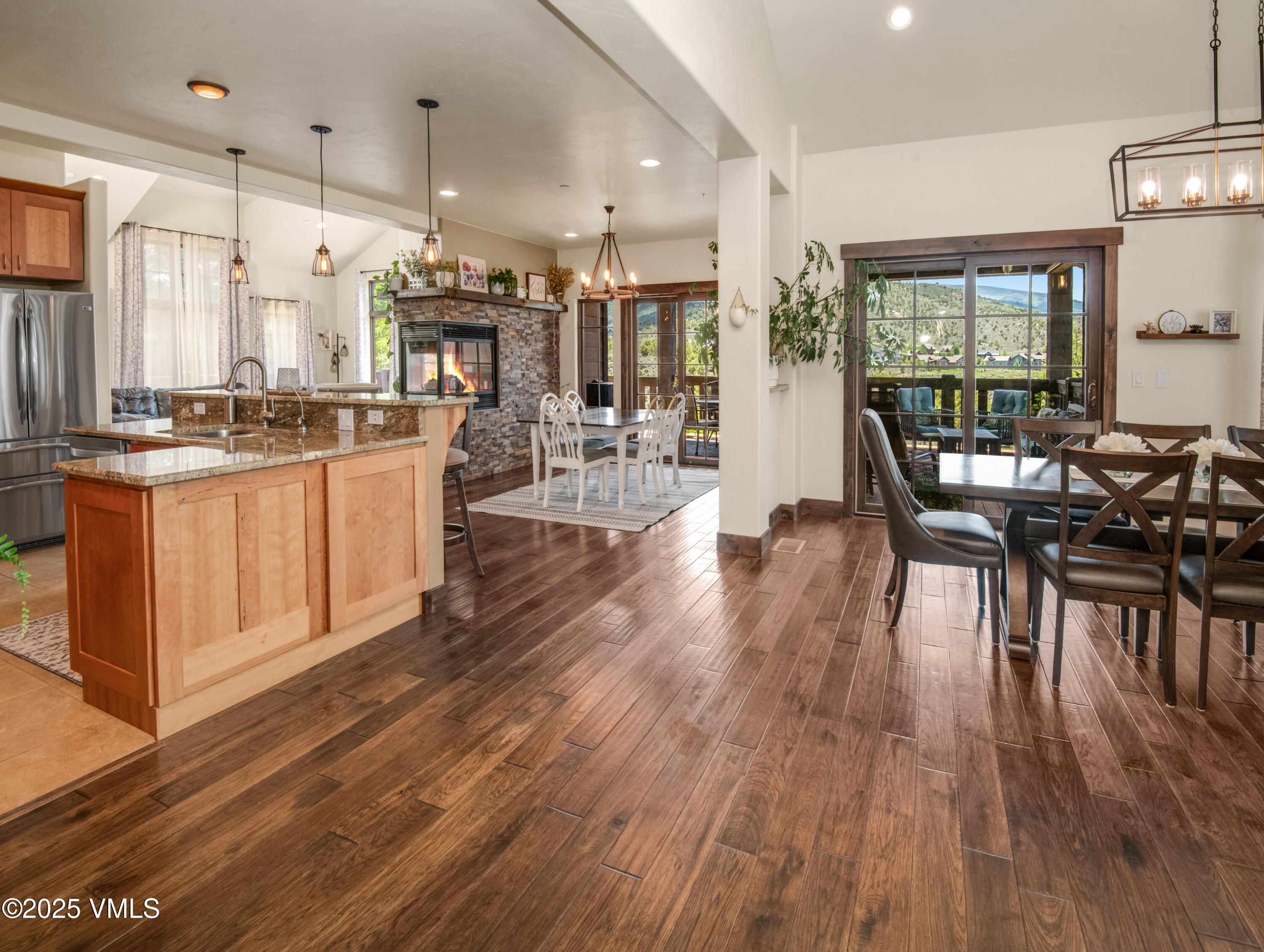75 Aster Court Eagle, CO 81631 - Photo 6 of 68 a view of a kitchen with dining room and wooden floor
