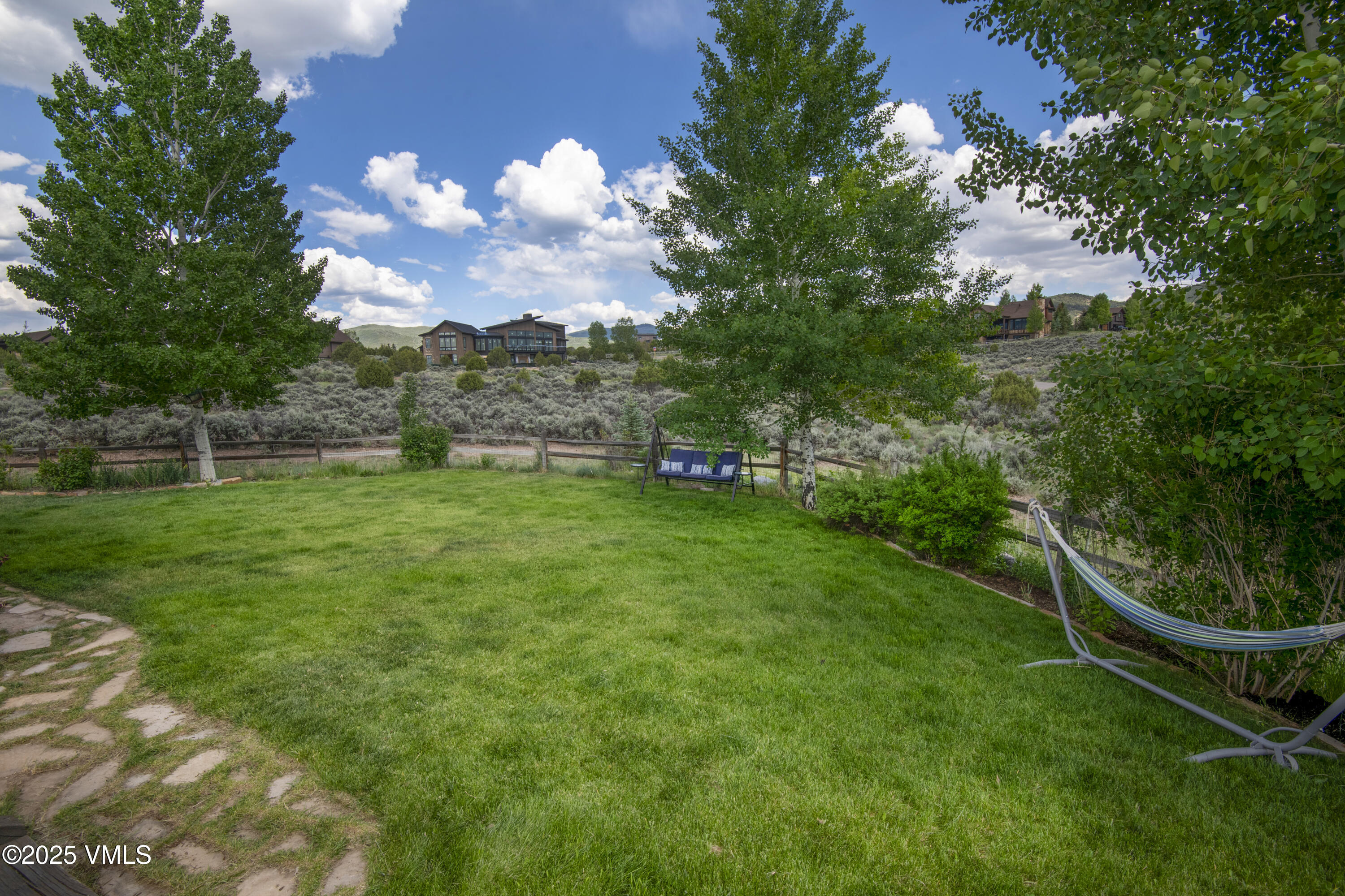 75 Aster Court Eagle, CO 81631 - Photo 61 of 68 a view of a golf course with a lake