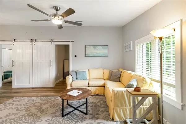 a living room with furniture and a window
