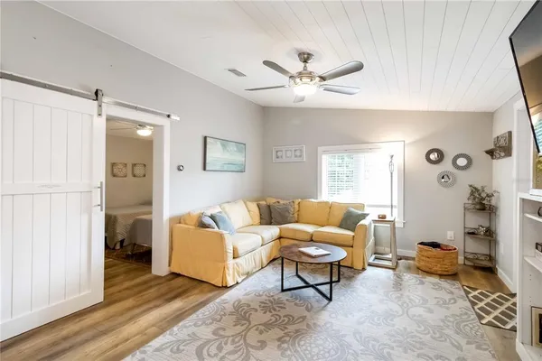 a living room with furniture and a window